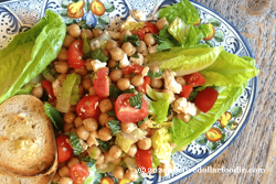 Chickpea, Tomato, Mint, and Feta Salad with Garlic-Parmesan Crostini